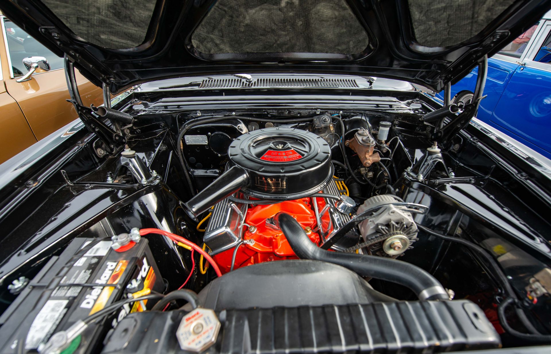 Detailed view of a vintage car engine highlighting its mechanics.