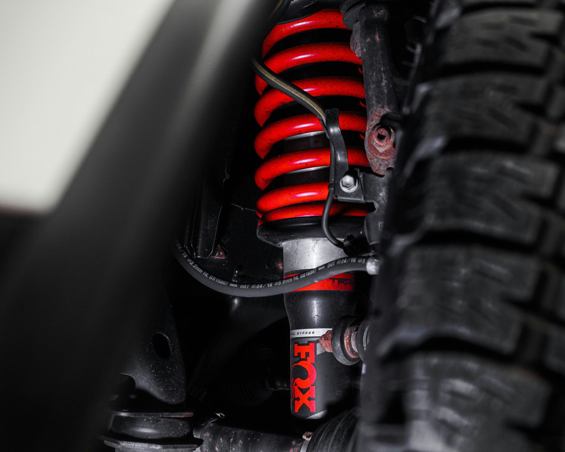 a close up of the front suspension of a vehicle